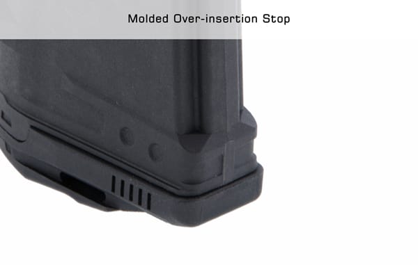 Over-insertion stop aids in magazine reliability