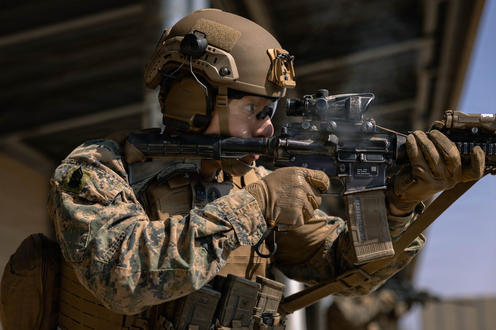 Prism optics compared on an AR-15, including ACOG-style 4x and compact 3x prisms
